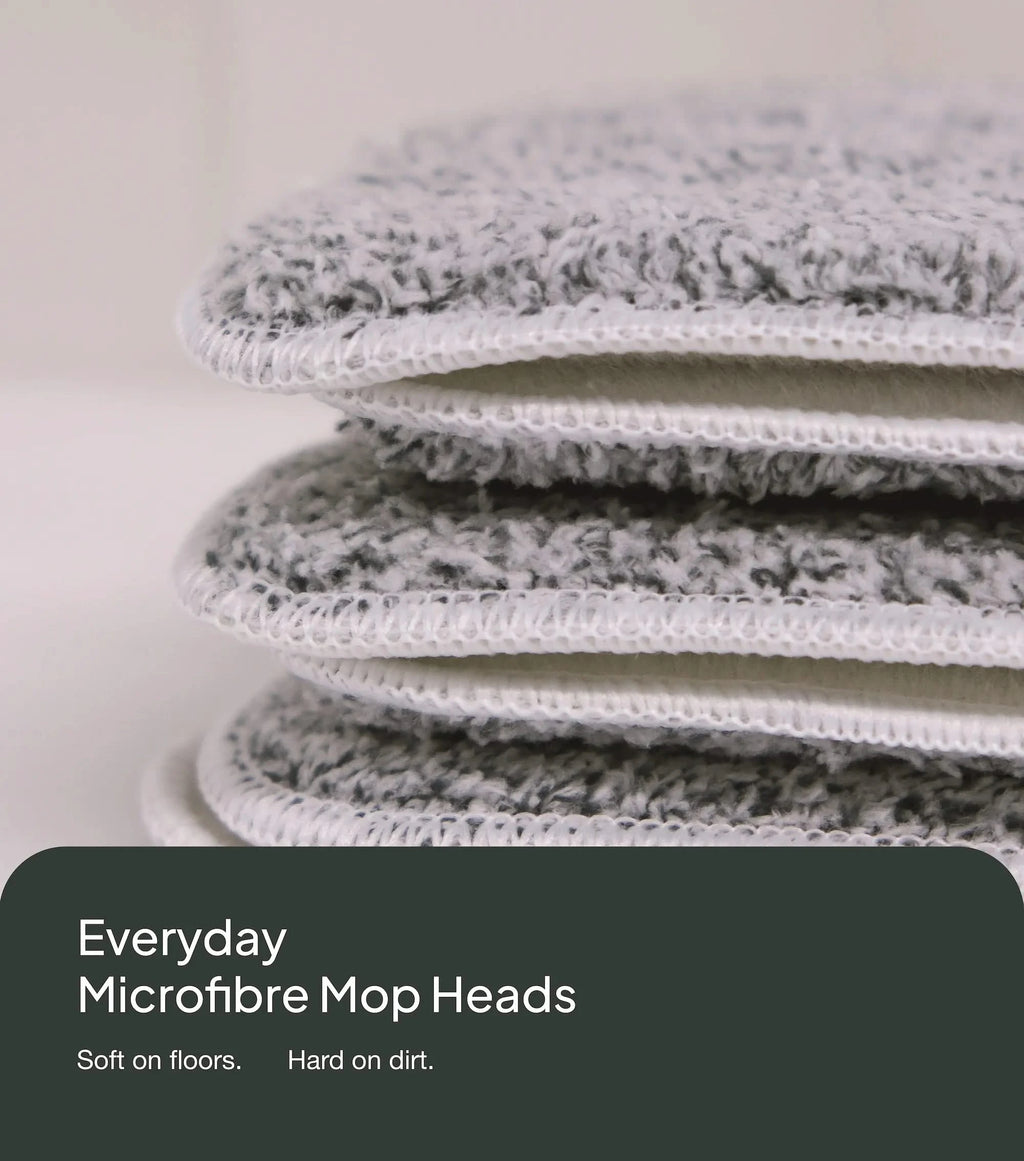 Stack of microfiber mop heads with a neutral background