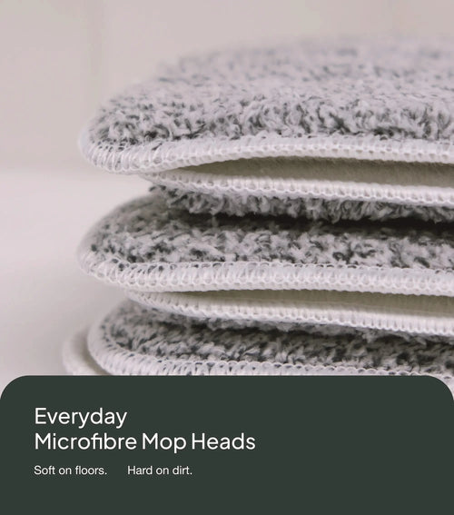 Stack of microfiber mop heads with a neutral background